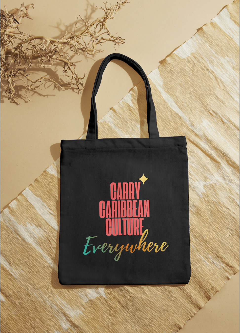 Black tote bag with Carry Caribbean Culture Everywhere colorful graphic print